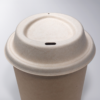 Plant-based compostable coffee lid made from upcycled hemp fiber, perfect for disposable hot beverage cups.