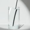 8-inch Black Long Sipper hemp straw in a glass of water